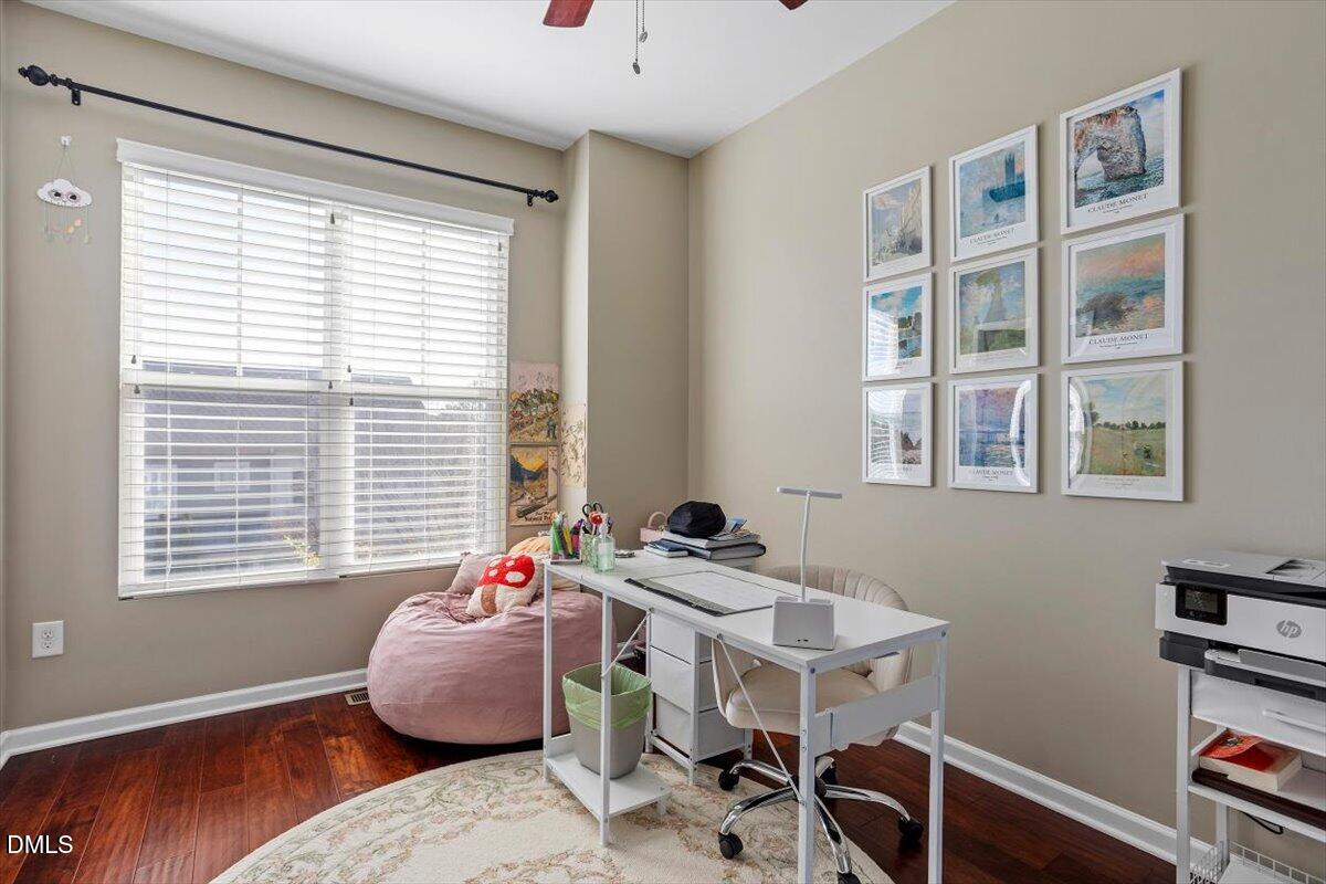 1427 Crafton Way Raleigh, NC 27607 - Photo 17 of 26 a bedroom with furniture and a window