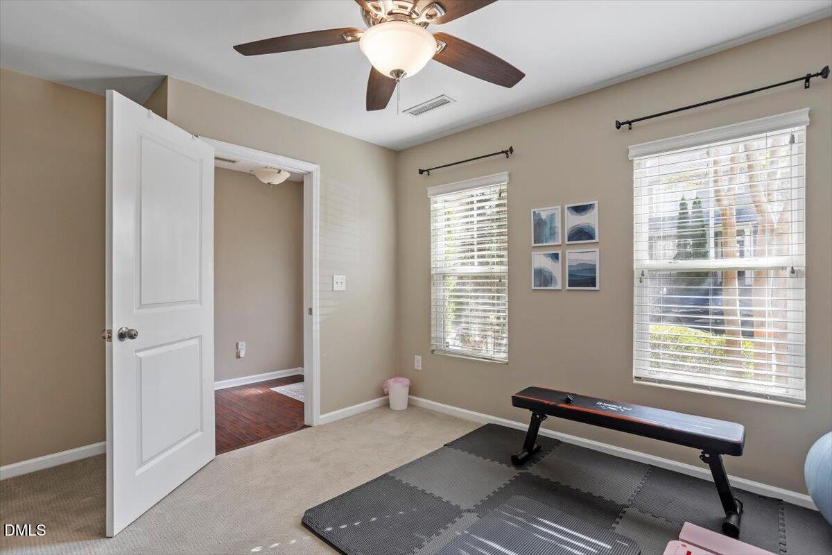 1427 Crafton Way Raleigh, NC 27607 - Photo 20 of 26 a living room with furniture and windows