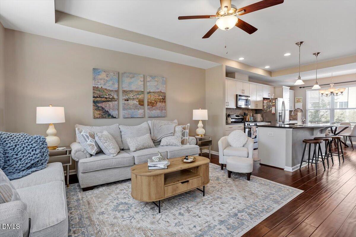 1427 Crafton Way Raleigh, NC 27607 - Photo 4 of 26 a living room with furniture and kitchen view