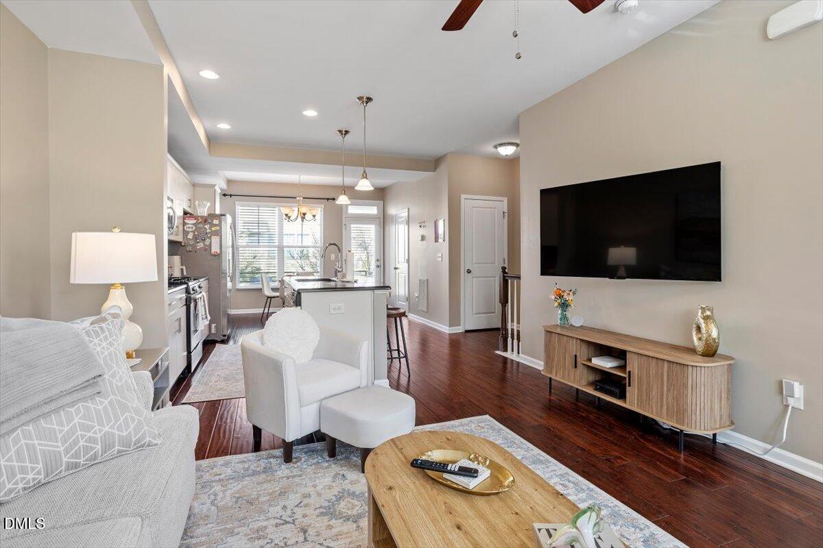 1427 Crafton Way Raleigh, NC 27607 - Photo 5 of 26 a living room with furniture and a flat screen tv
