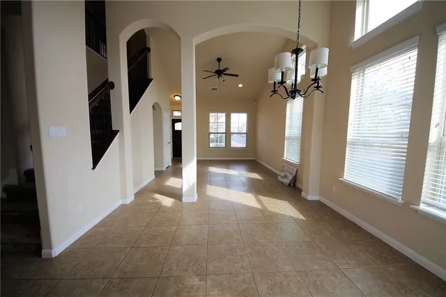 a view of a hallway with a chandelier
