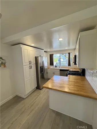 a view of a living room with hardwood floor