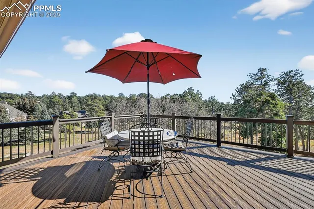a view of balcony with deck and outdoor seating