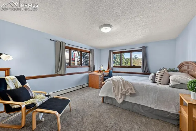 a bedroom with bed and window