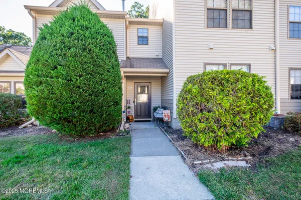 a view of a pathway in front of a house