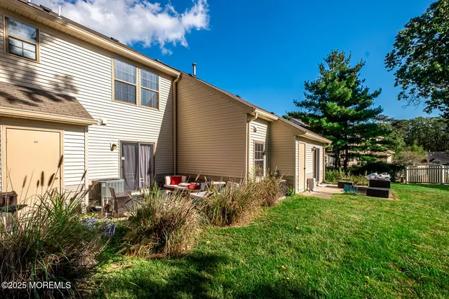 a backyard of a house with seating space