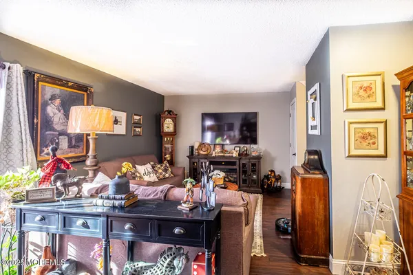 a room with furniture a flat screen tv and a fireplace
