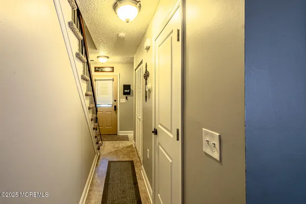a view of a hallway with a door