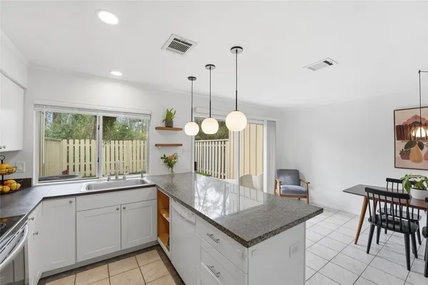 a very nice looking dining room with a table and chairs