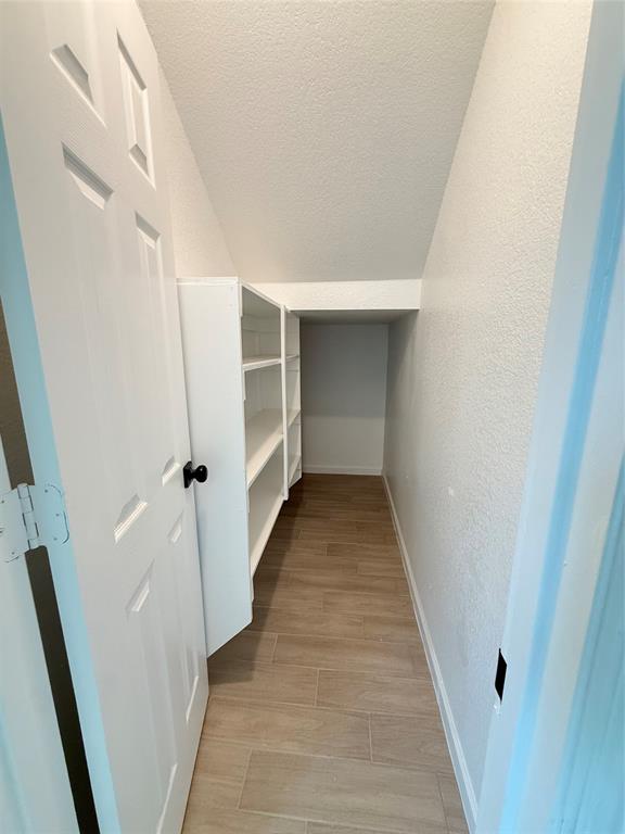 2864 Burchill Road Fort Worth, TX 76105 - Photo 15 of 26 a view of a hallway with wooden floor and entryway