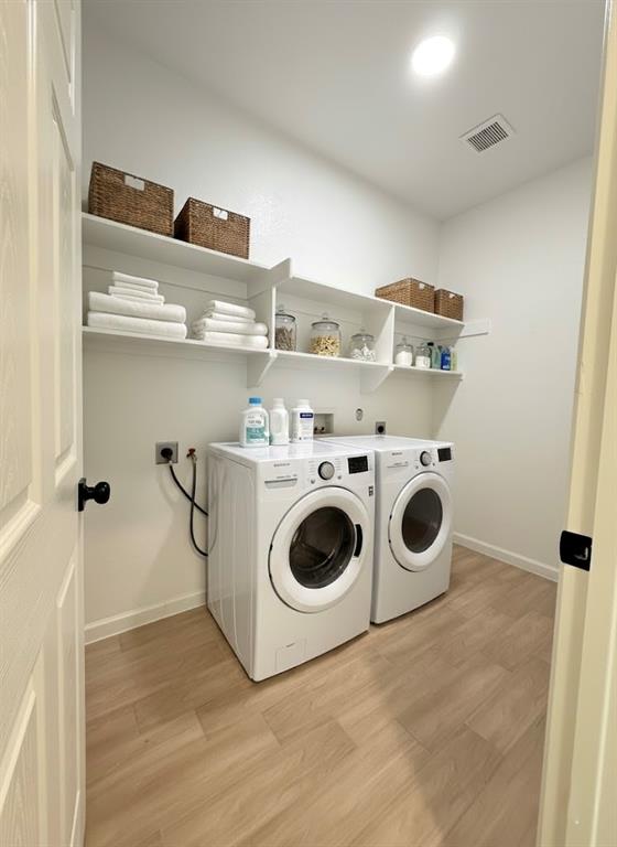 2864 Burchill Road Fort Worth, TX 76105 - Photo 22 of 26 a utility room with dryer and washer
