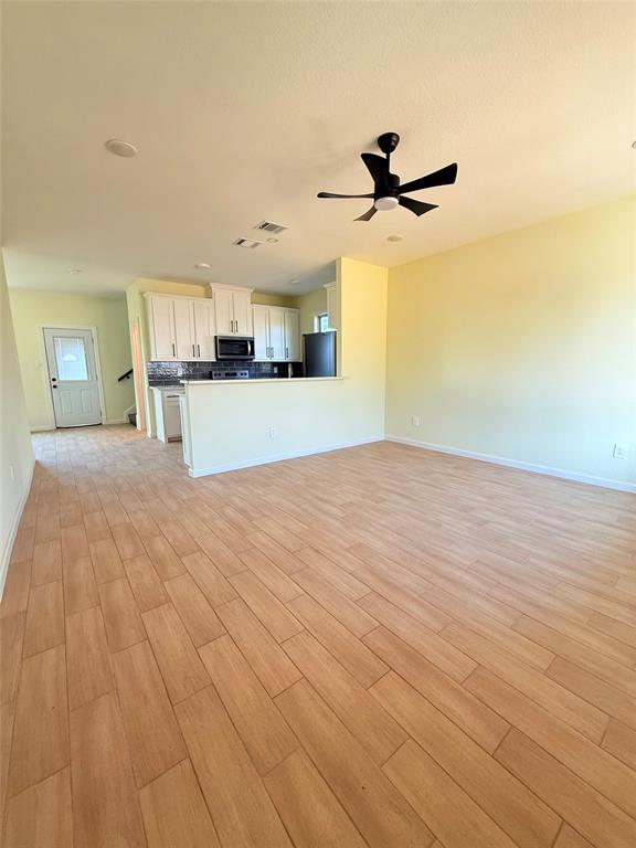 2864 Burchill Road Fort Worth, TX 76105 - Photo 3 of 26 a view of a kitchen with a sink and cabinets