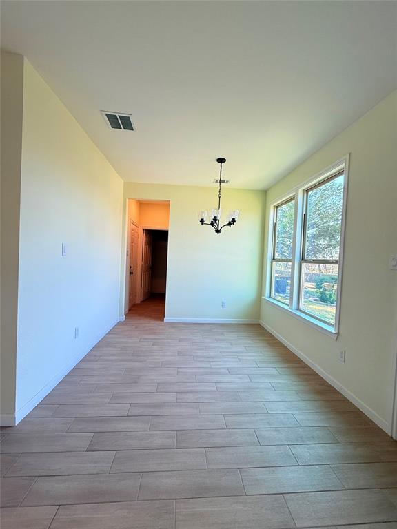 2864 Burchill Road Fort Worth, TX 76105 - Photo 6 of 26 a view of a big room with windows and cabinet