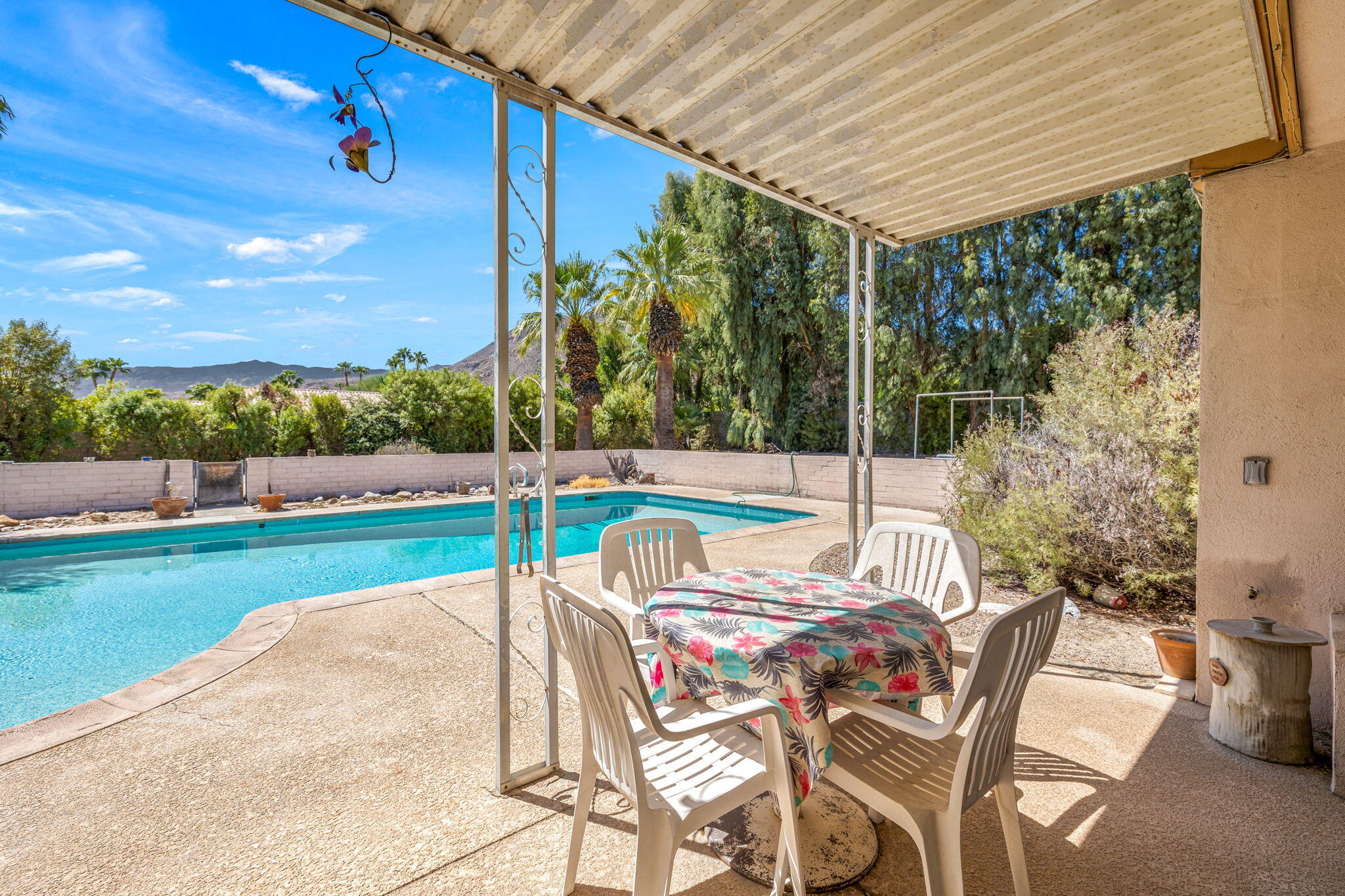 72227 Rancho Road Rancho Mirage, CA 92270 - Photo 22 of 47 a backyard of a house with table and chairs