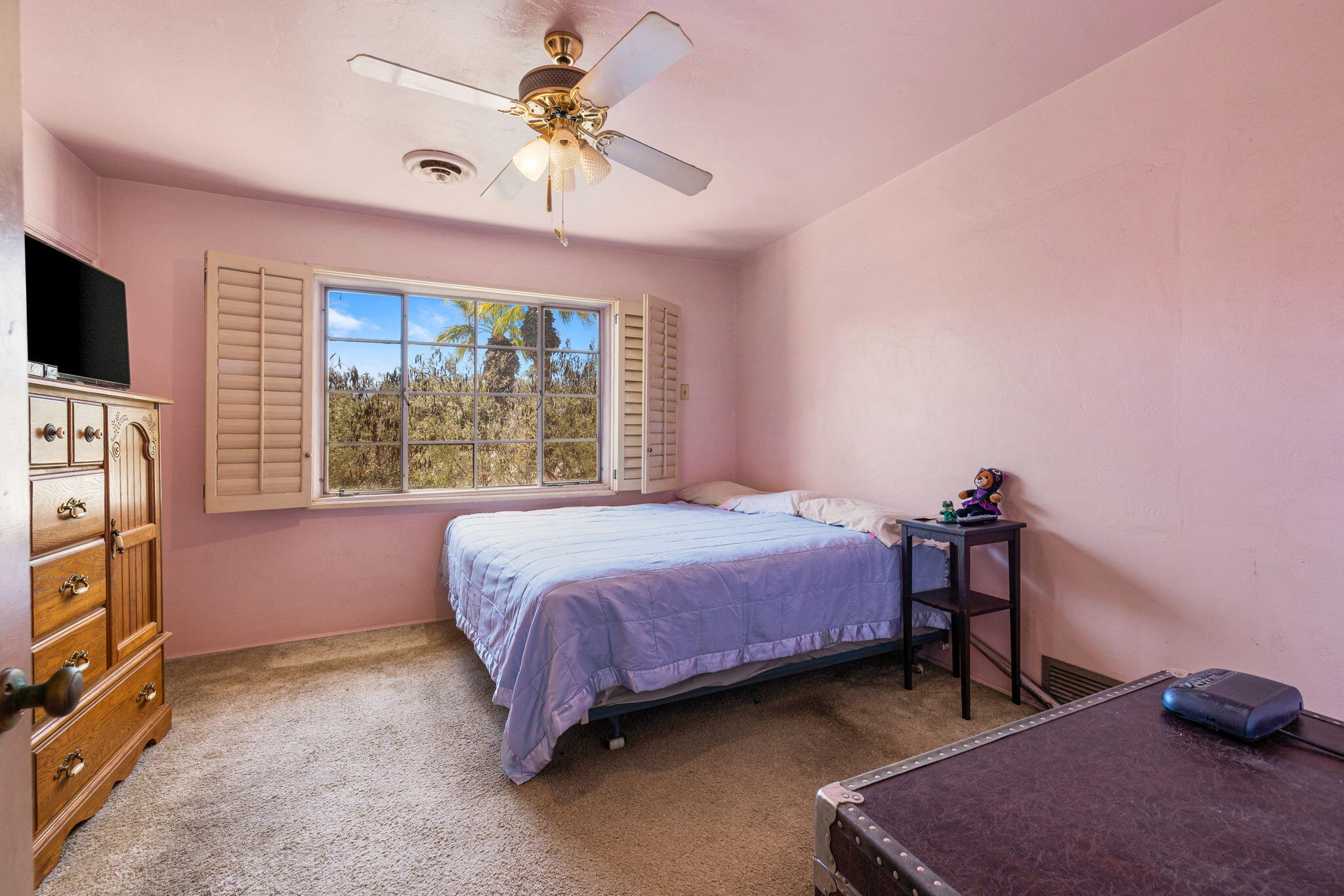 72227 Rancho Road Rancho Mirage, CA 92270 - Photo 36 of 47 a bedroom with a bed and a flat tv screen on the dresser