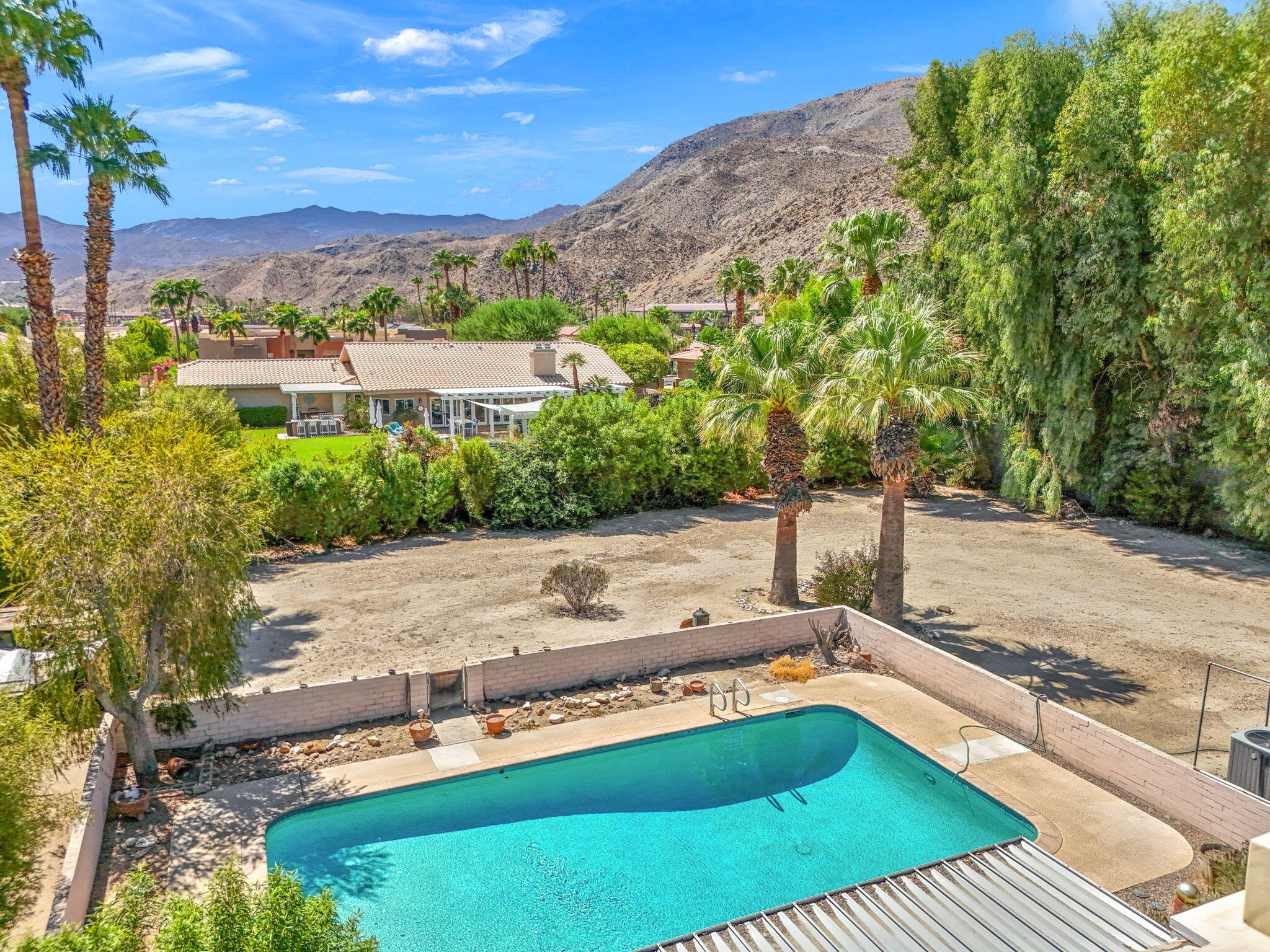 72227 Rancho Road Rancho Mirage, CA 92270 - Photo 7 of 47 a view of a backyard with sitting area
