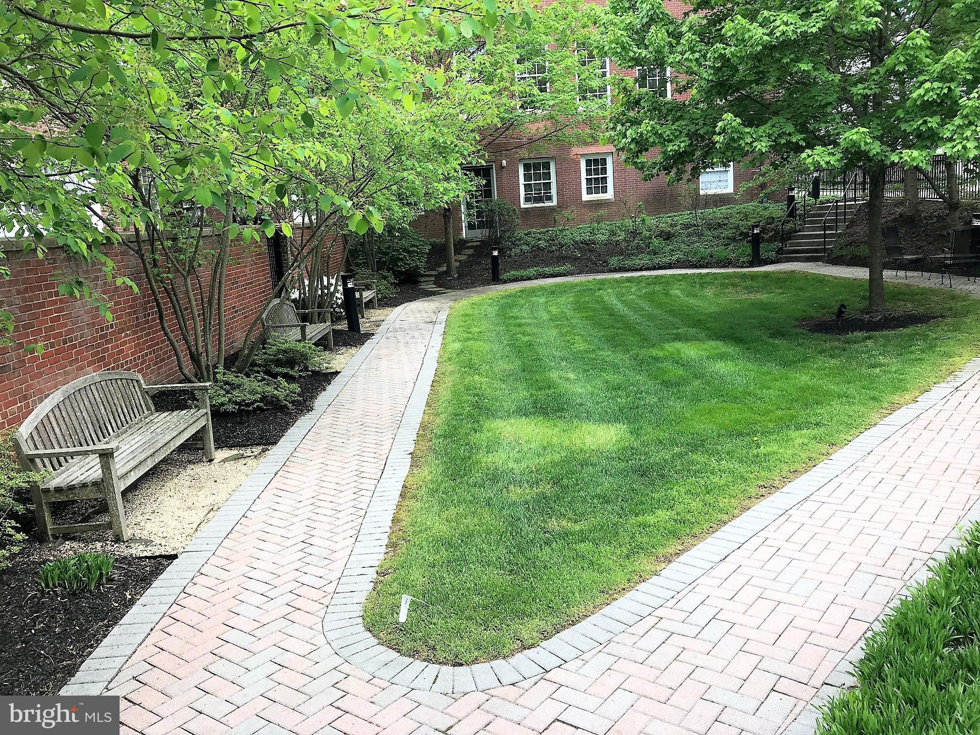 35 Quarry Street, Unit 104 Princeton, NJ 08542 - Photo 11 of 12 a front view of a house with a yard
