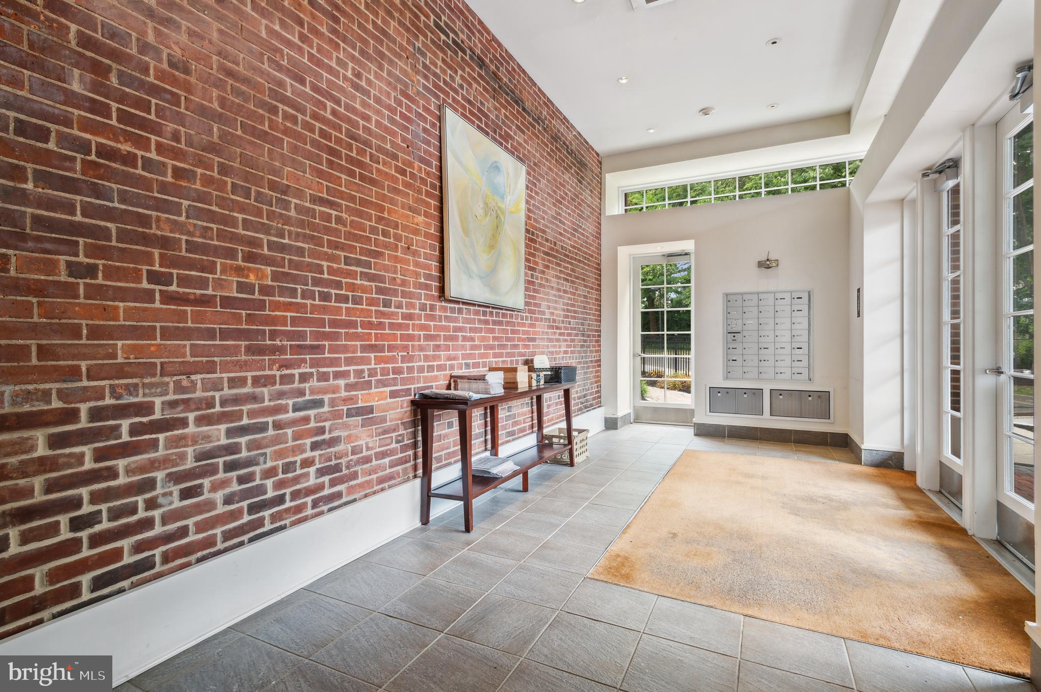35 Quarry Street, Unit 104 Princeton, NJ 08542 - Photo 3 of 12 a view of a brick house with large windows