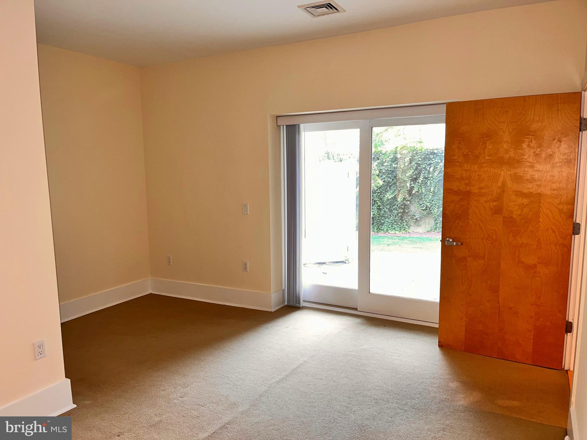35 Quarry Street, Unit 104 Princeton, NJ 08542 - Photo 9 of 12 an empty room with windows