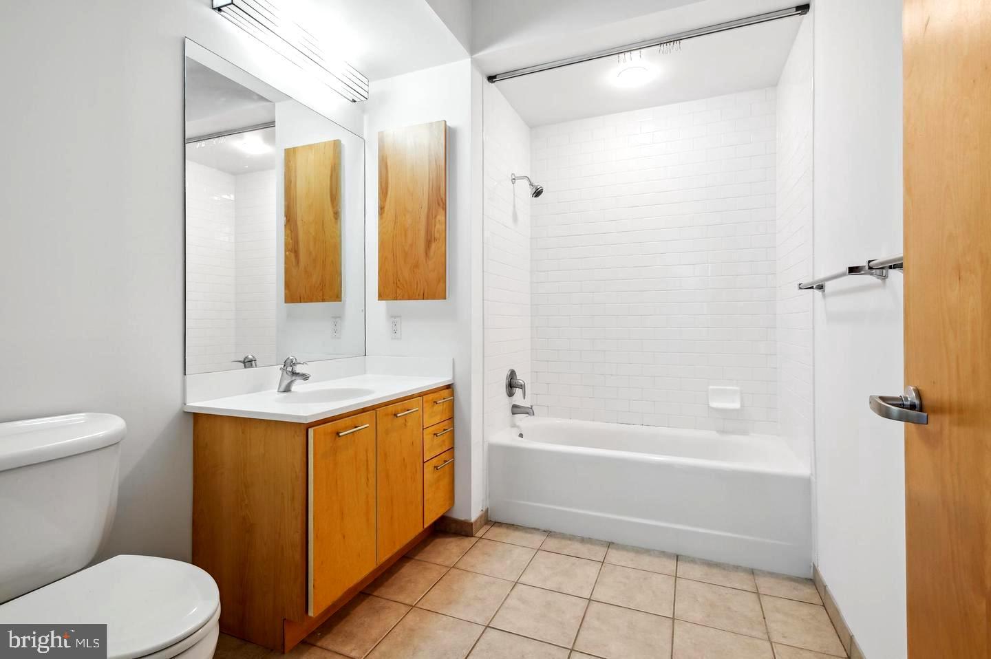 35 Quarry Street, Unit 104 Princeton, NJ 08542 - Photo 10 of 12 a bathroom with a sink a toilet and shower