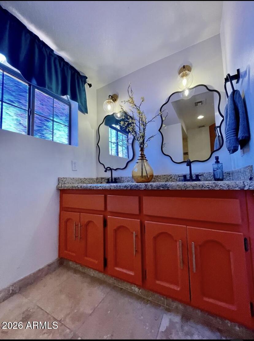 908 West Flynn Lane Phoenix, AZ 85013 - Photo 13 of 23 a bathroom with a sink and a mirror