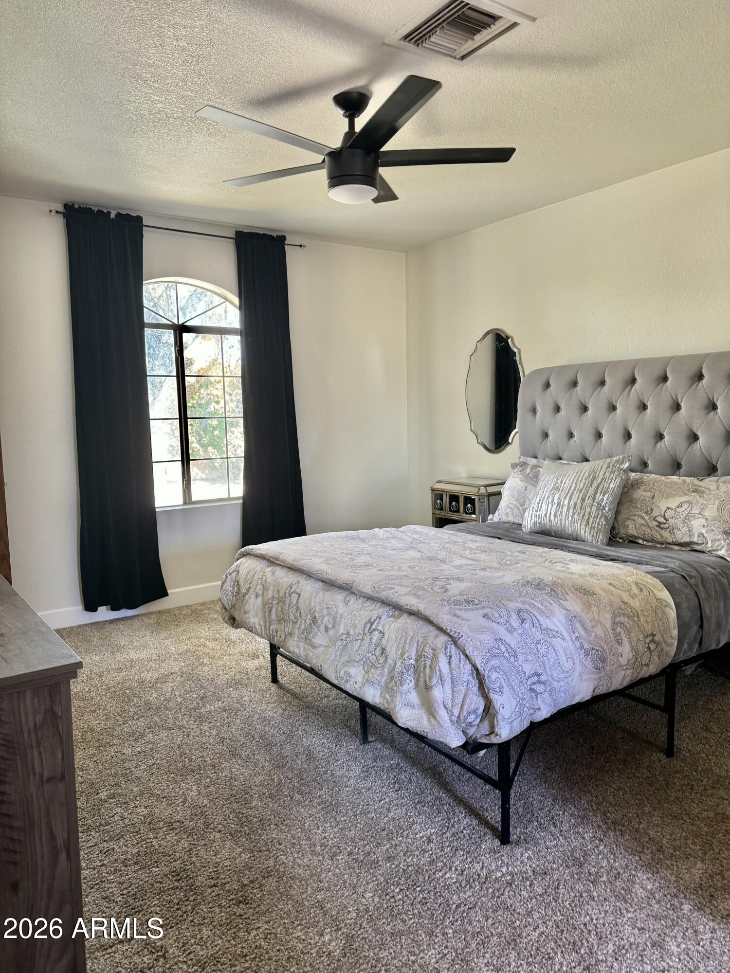 908 West Flynn Lane Phoenix, AZ 85013 - Photo 15 of 19 a bedroom with a bed and window