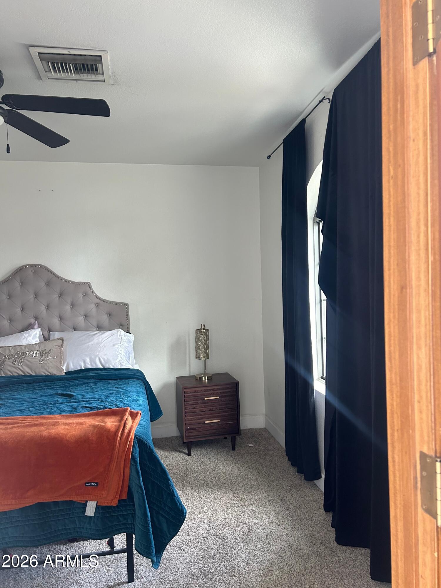 908 West Flynn Lane Phoenix, AZ 85013 - Photo 18 of 23 a bedroom with a bed and a window