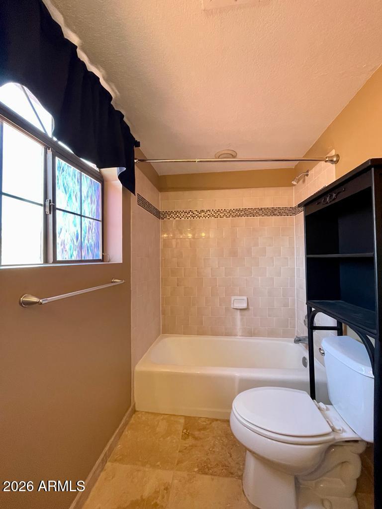 908 West Flynn Lane Phoenix, AZ 85013 - Photo 20 of 23 a bathroom with a toilet a sink and bathtub