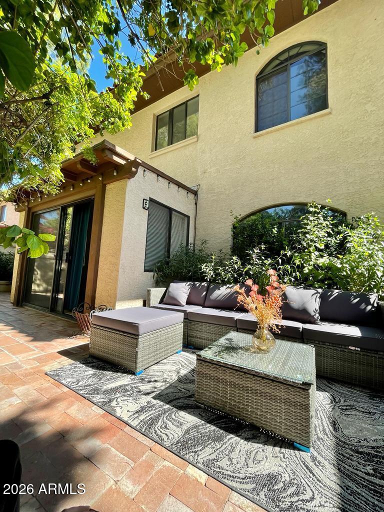 908 West Flynn Lane Phoenix, AZ 85013 - Photo 23 of 23 a view of a patio with couches table and chairs and potted plants