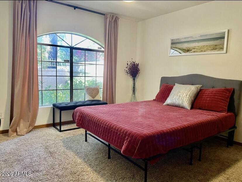 908 West Flynn Lane Phoenix, AZ 85013 - Photo 8 of 19 a bed sitting in a bedroom next to a window