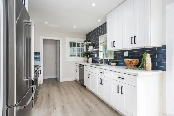 a kitchen with a sink and cabinets