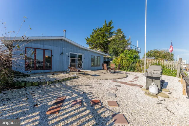 a view of a backyard with sitting area