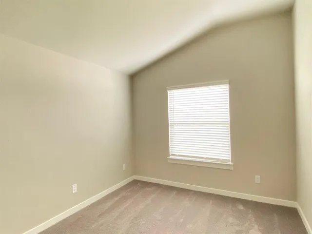 a spacious bathroom with a shower and a sink