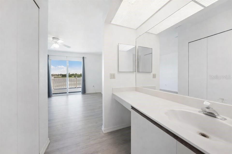 26272 Rampart Boulevard, Unit 107 Punta Gorda, FL 33983 - Photo 15 of 18 a bathroom with a sink and a mirror