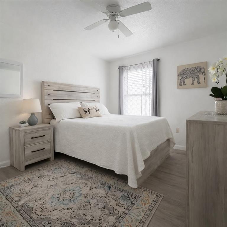 26272 Rampart Boulevard, Unit 107 Punta Gorda, FL 33983 - Photo 8 of 18 a bedroom with a bed and window