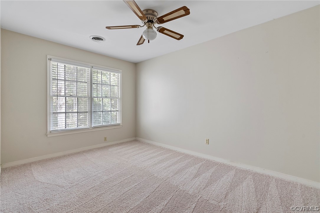 5407 Chestnut Bluff Road Midlothian, VA 23112 - Photo 16 of 35 an empty room with a window and a fan