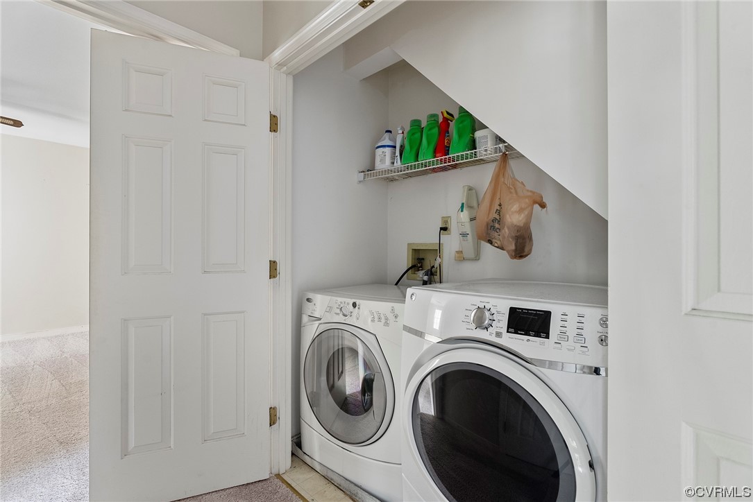 5407 Chestnut Bluff Road Midlothian, VA 23112 - Photo 20 of 35 a view of washer and dryer with kitchen in the background