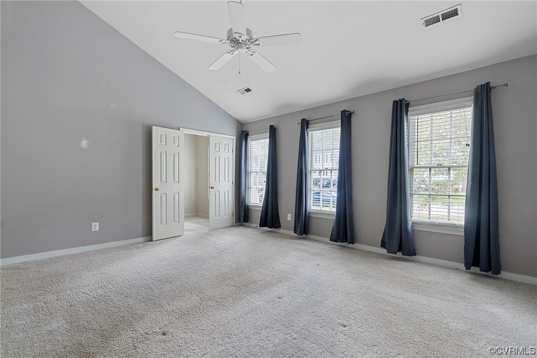 5407 Chestnut Bluff Road Midlothian, VA 23112 - Photo 23 of 35 a view of a livingroom with a chandelier fan and windows