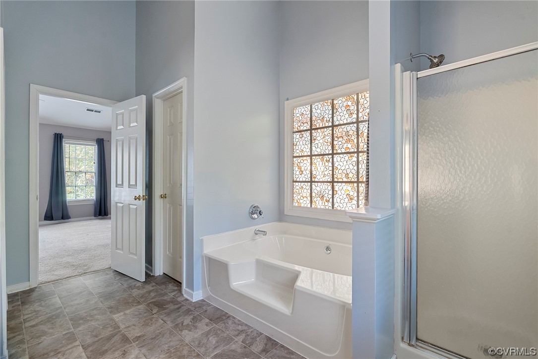 5407 Chestnut Bluff Road Midlothian, VA 23112 - Photo 25 of 35 a spacious bathroom with a bathtub and a shower