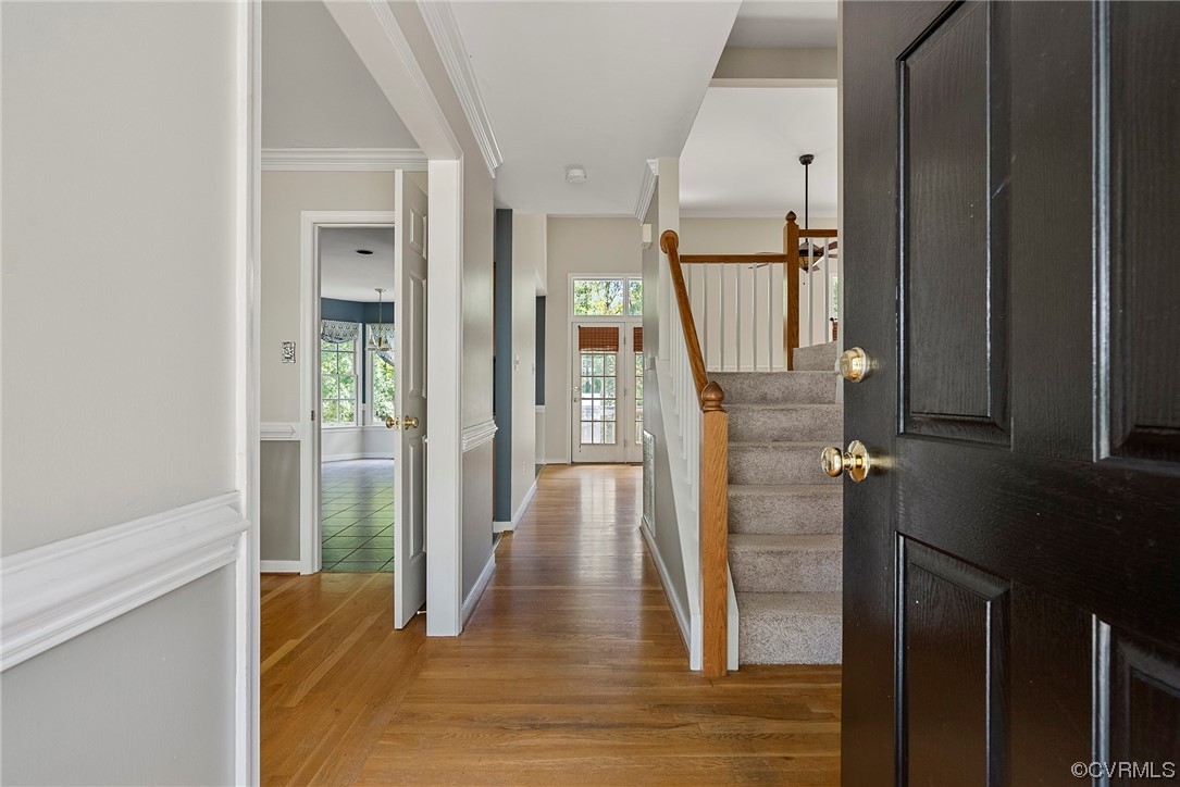 5407 Chestnut Bluff Road Midlothian, VA 23112 - Photo 3 of 35 a view of a hallway with wooden floor and staircase