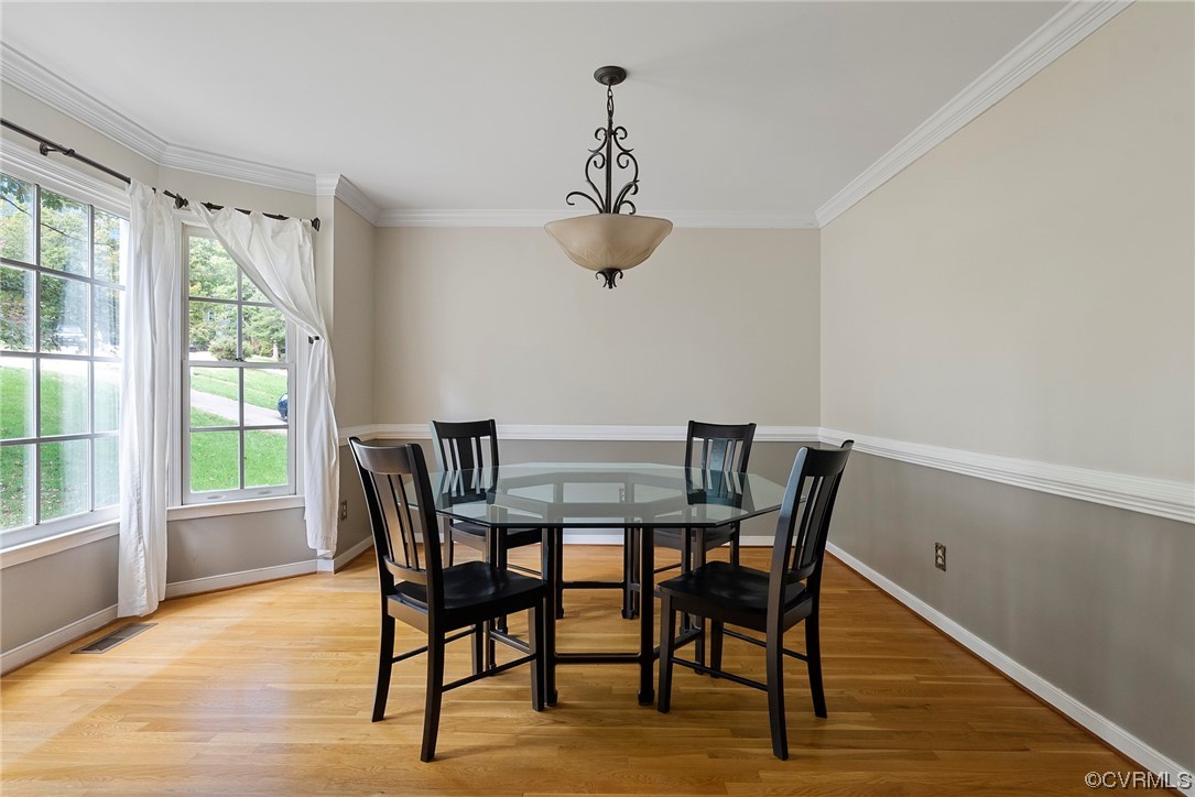 5407 Chestnut Bluff Road Midlothian, VA 23112 - Photo 4 of 35 a view of a dining room with furniture window and wooden floor