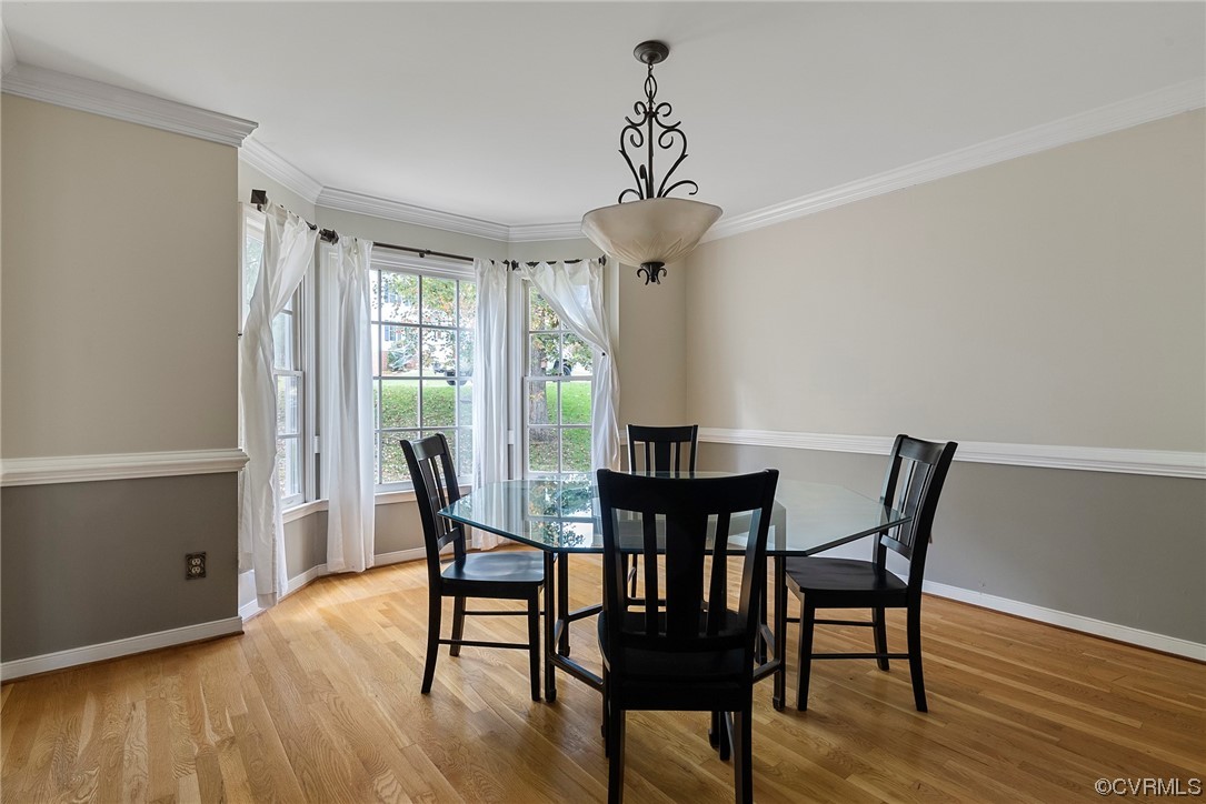 5407 Chestnut Bluff Road Midlothian, VA 23112 - Photo 5 of 35 a view of a dining room with furniture window and wooden floor
