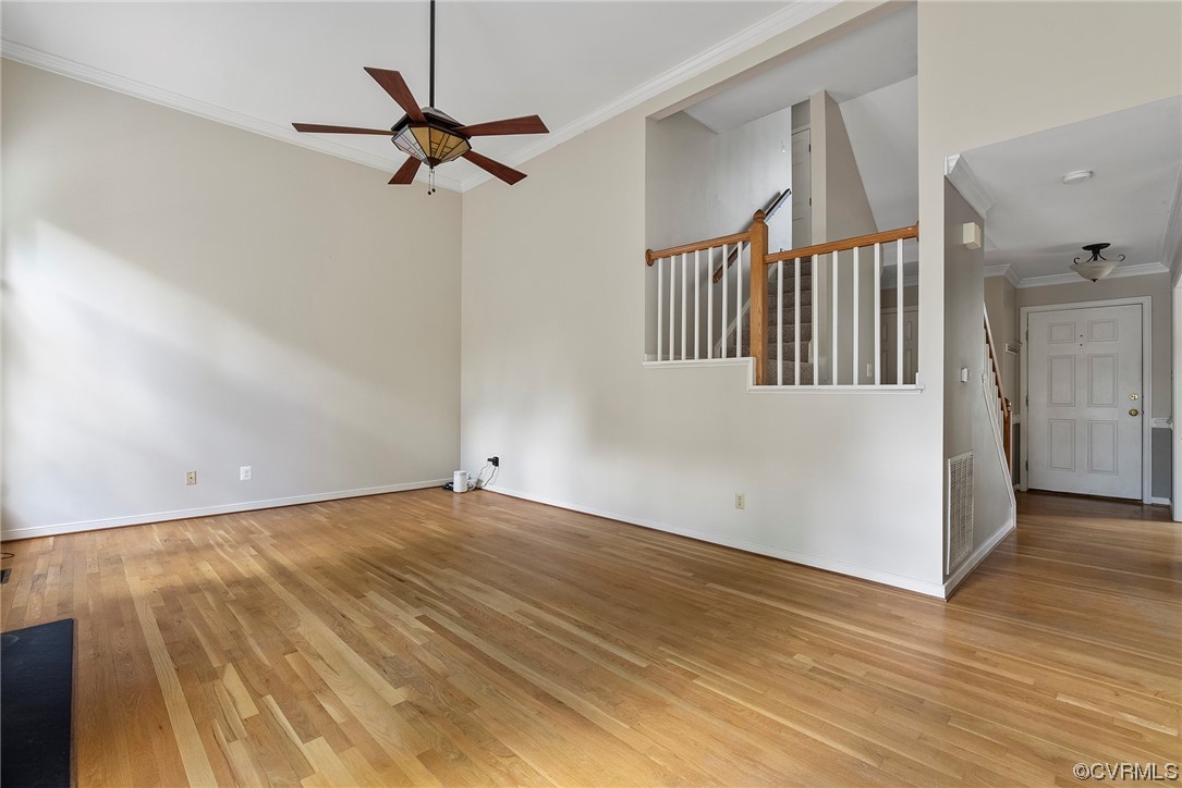 5407 Chestnut Bluff Road Midlothian, VA 23112 - Photo 10 of 35 an empty room with wooden floor fan and windows