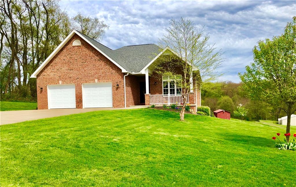 182 Arner Road Freeport, PA 16229 - Photo 1 of 25 Welcome Home to your custom built brick ranch with huge concrete driveway and heated garage floors. Beautiful landscaped yard!
