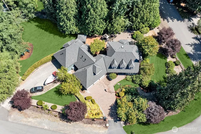 an aerial view of house with a yard