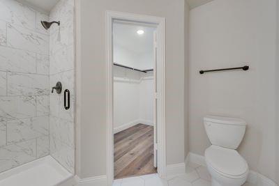 721 North Jefferson Street Pilot Point, TX 76258 - Photo 11 of 12 a bathroom with a toilet and a shower