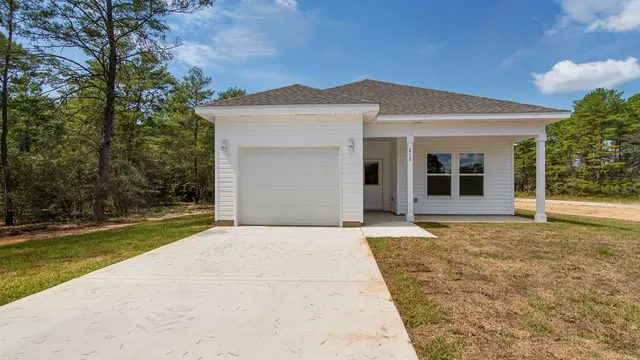 a house with yard in front of it