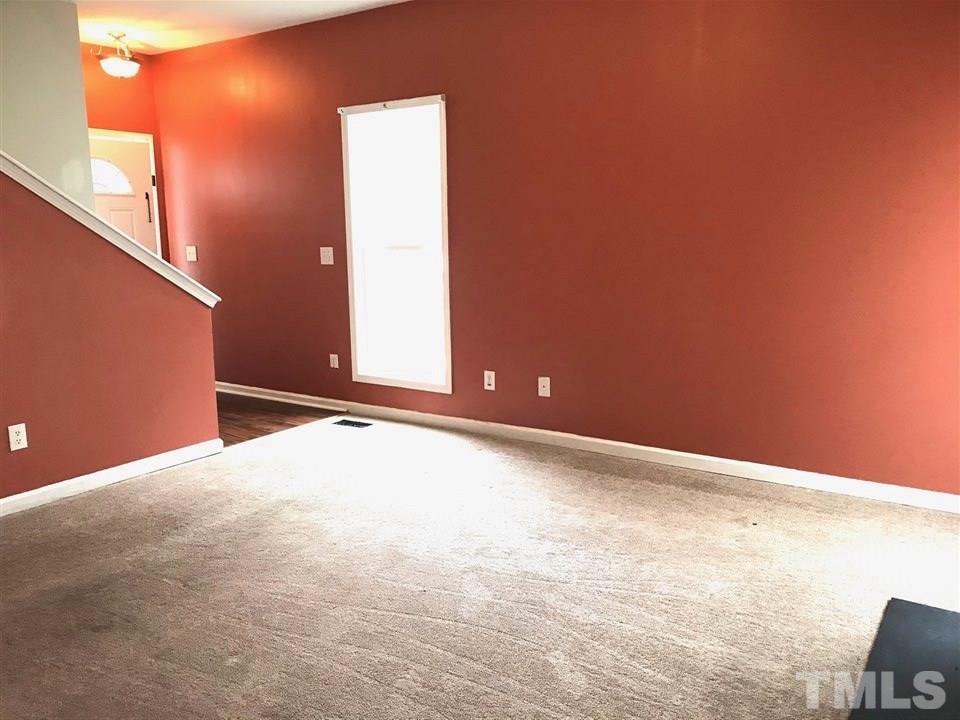 3832 Pin Oak Road Raleigh, NC 27604 - Photo 8 of 14 a view of an empty room with wooden floor