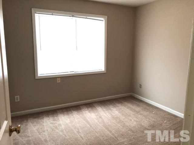3832 Pin Oak Road Raleigh, NC 27604 - Photo 9 of 14 an empty room with a window