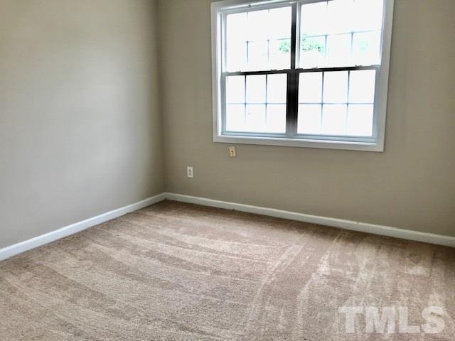 3832 Pin Oak Road Raleigh, NC 27604 - Photo 10 of 14 an empty room with a window